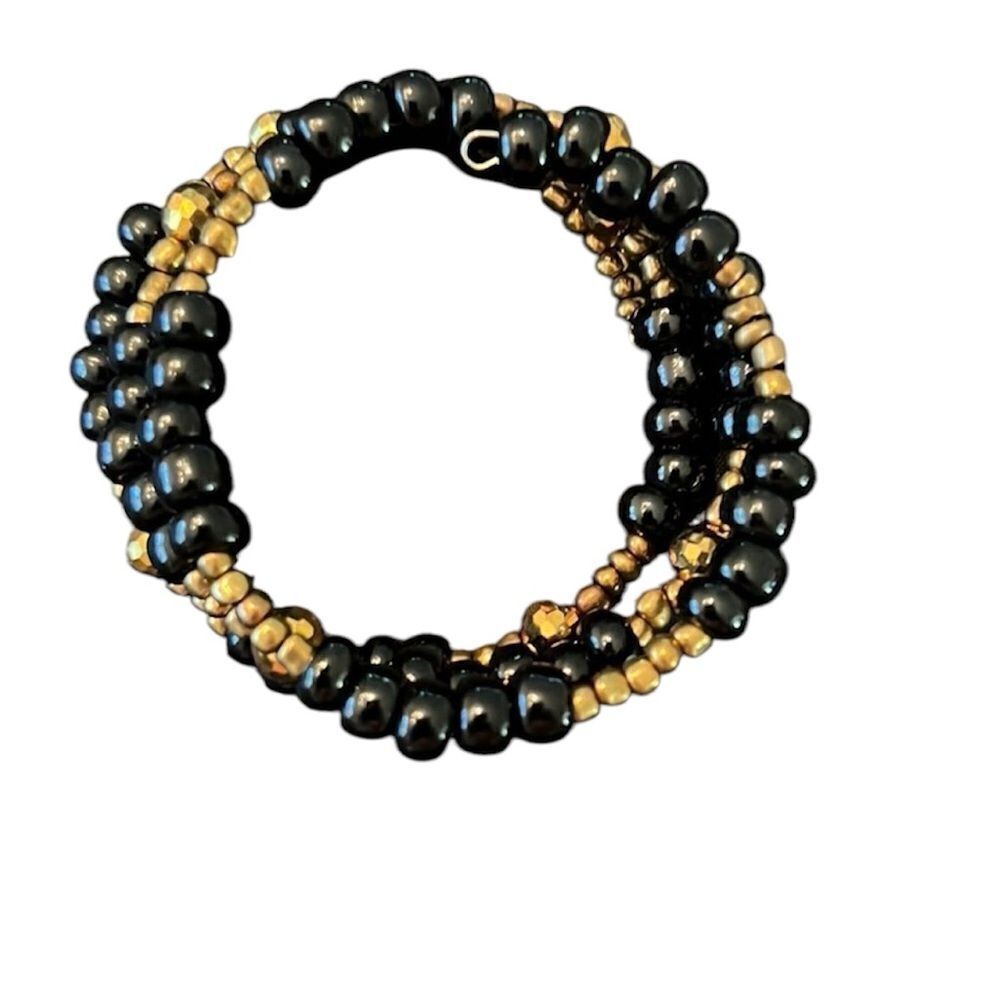 Gold and black beaded spiral bracelet this adjustable style fits all arm sizes